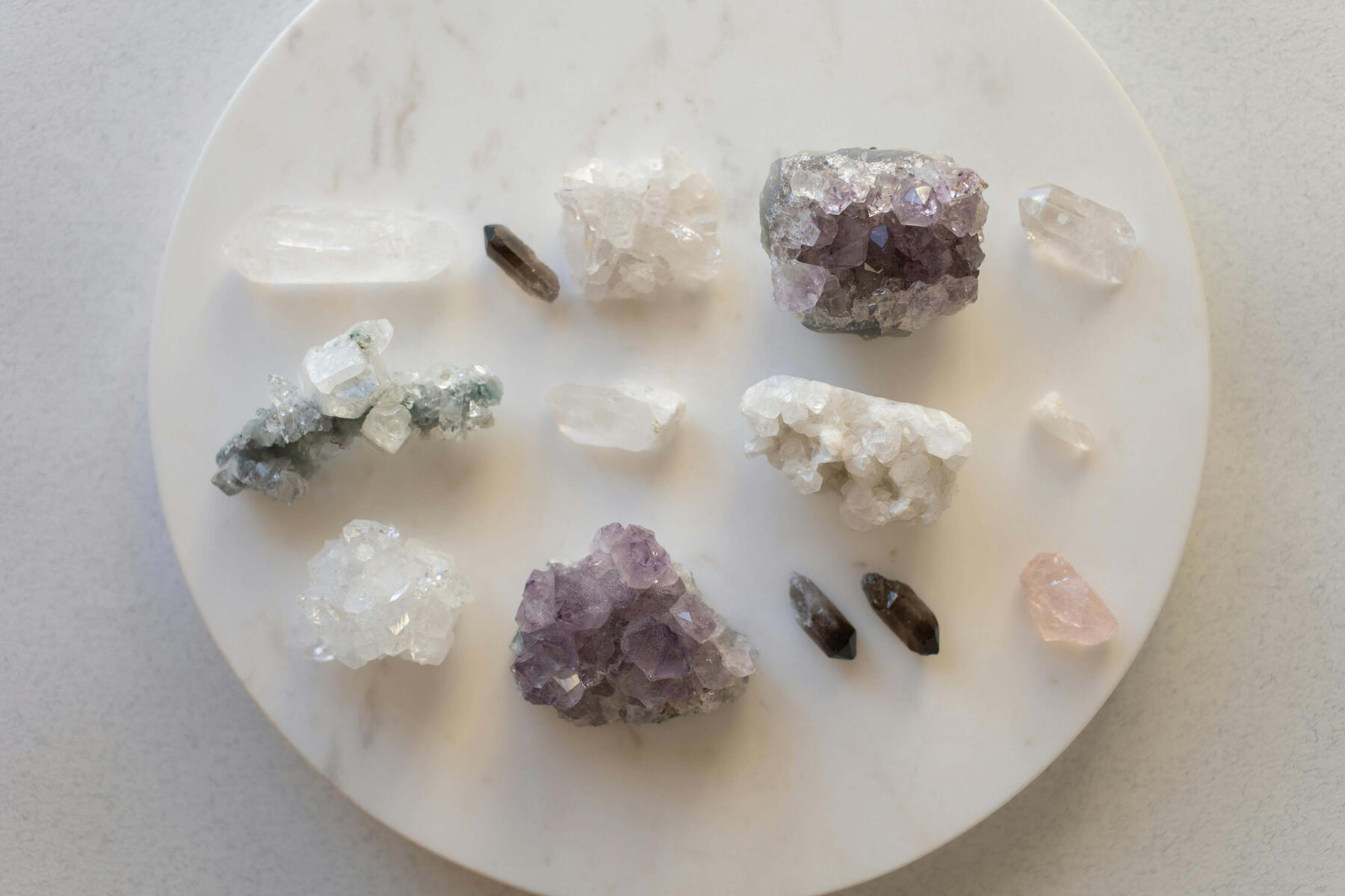 Photo of Clear Quartz, Smoky Quartz and Amethyst crystals.